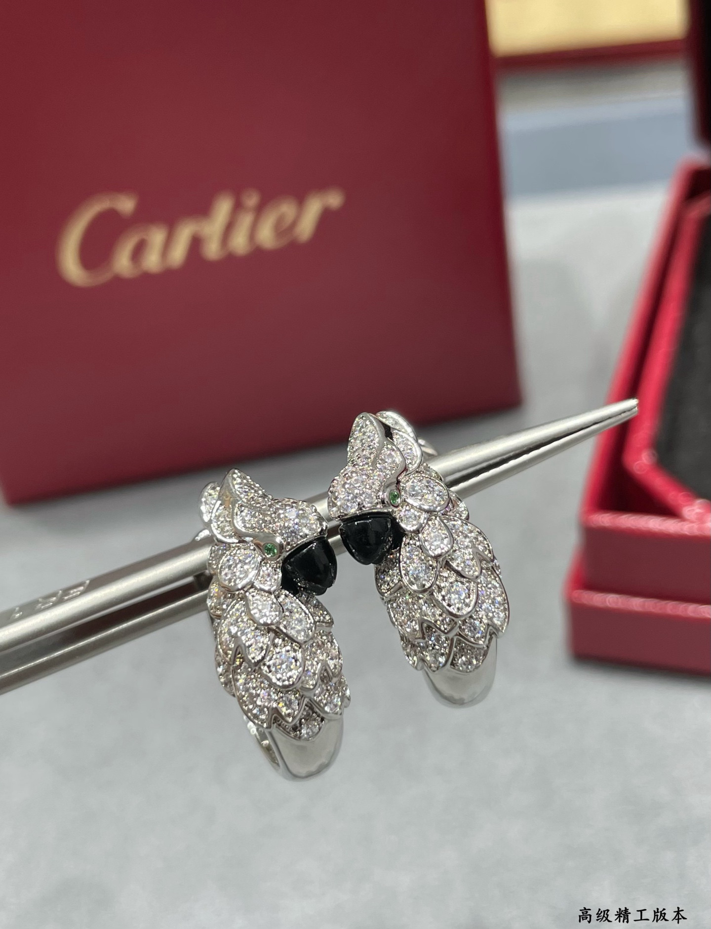 Ca*t*er parrot earrings