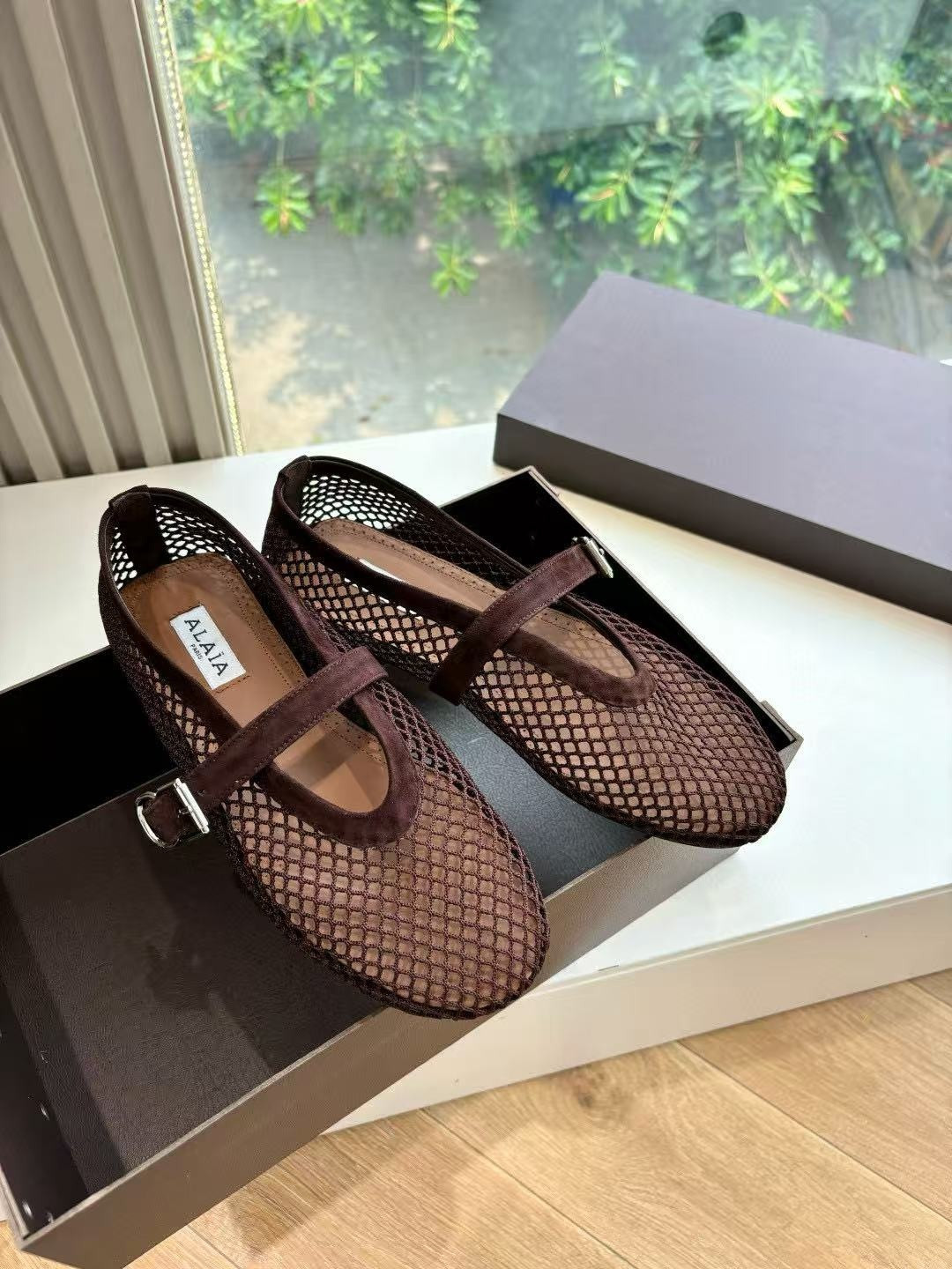UA ALAÏA BALLET FLATS IN FISHNET