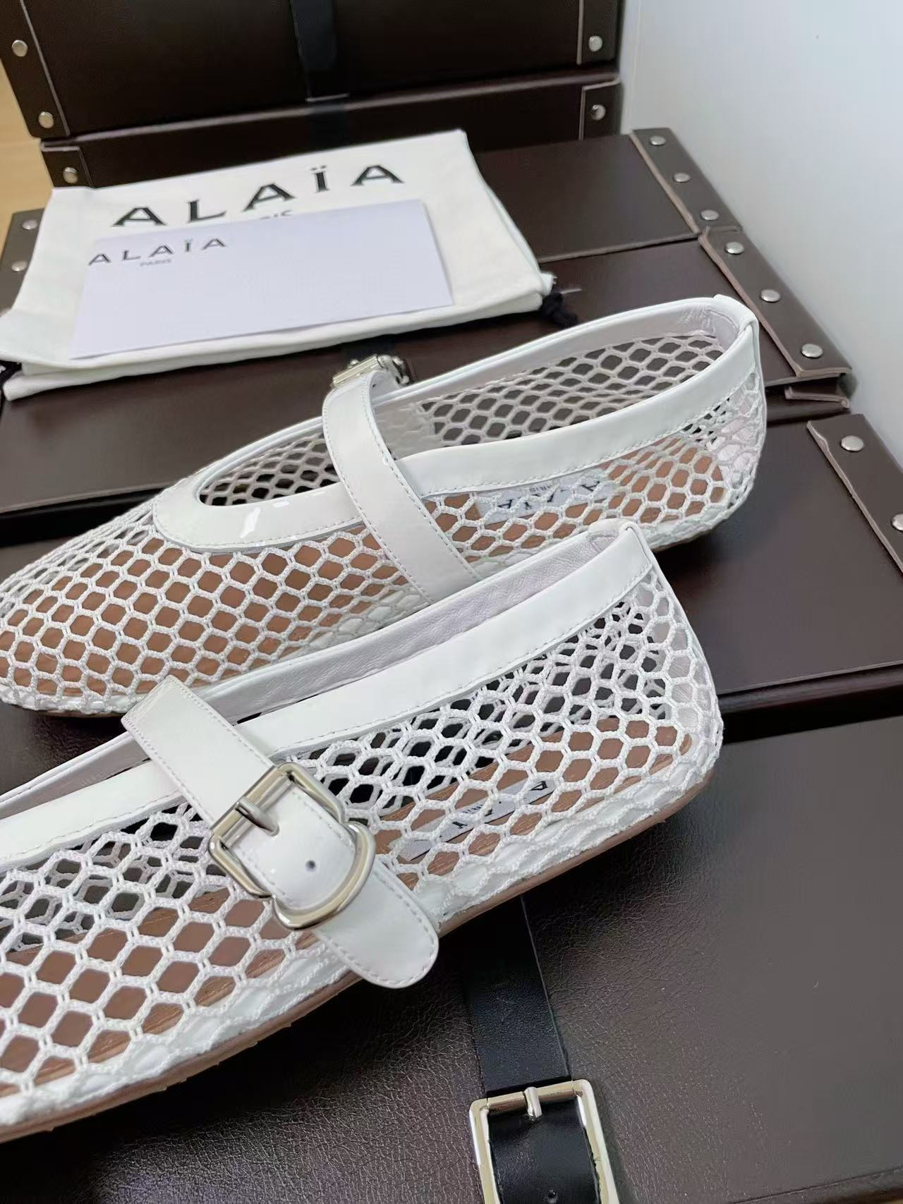 UA ALAÏA BALLET FLATS IN FISHNET