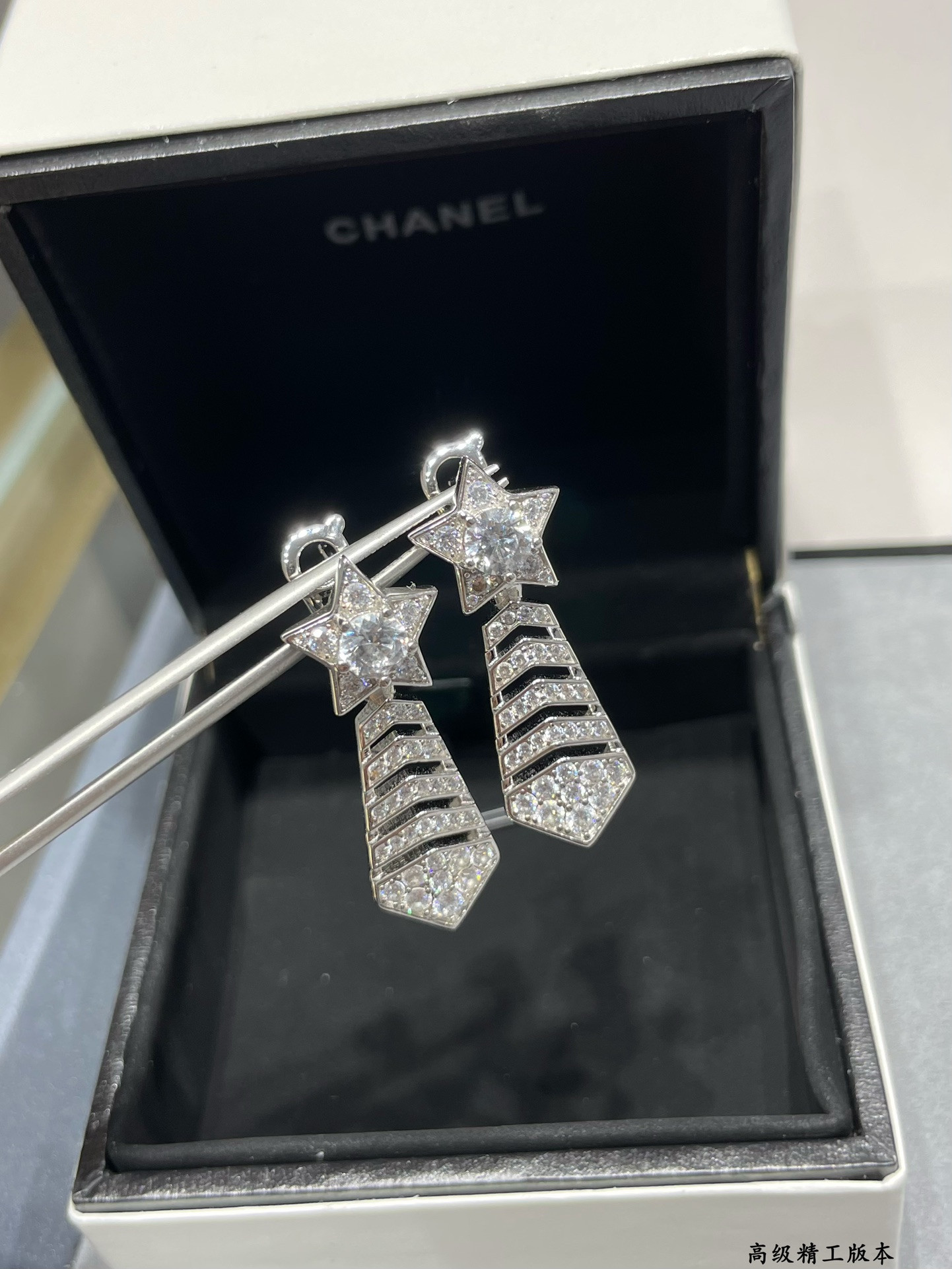 Ch*el comet earrings