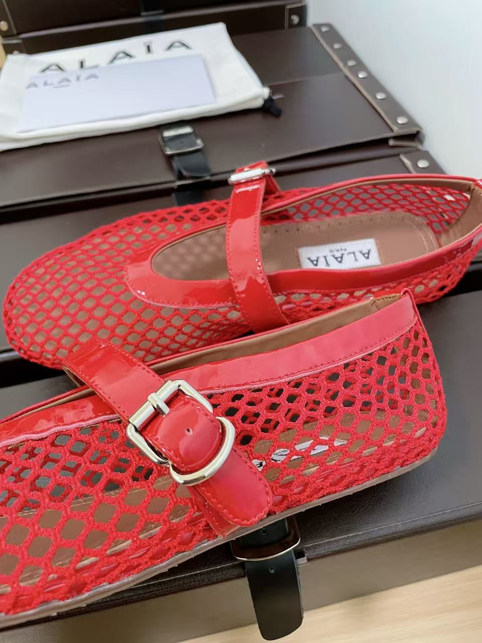 UA ALAÏA BALLET FLATS IN FISHNET