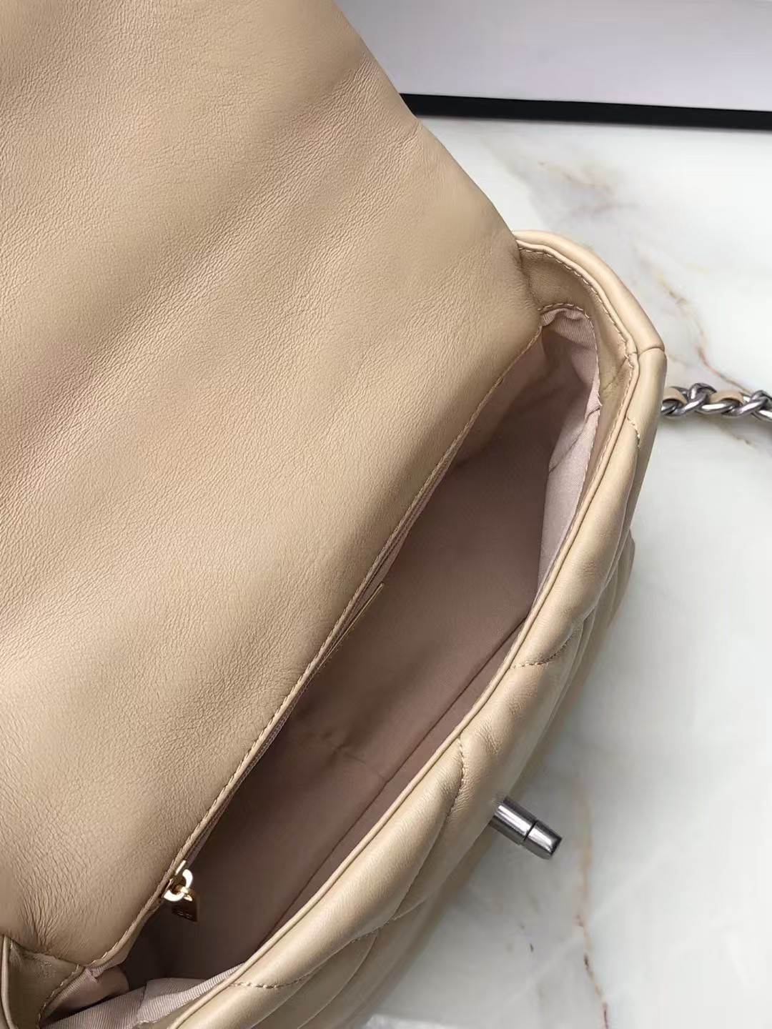 Ch*el 19 handbag shiny leather, gold-tone, silver-tone & ruthenium-finish metal beige 26x16x9cm
