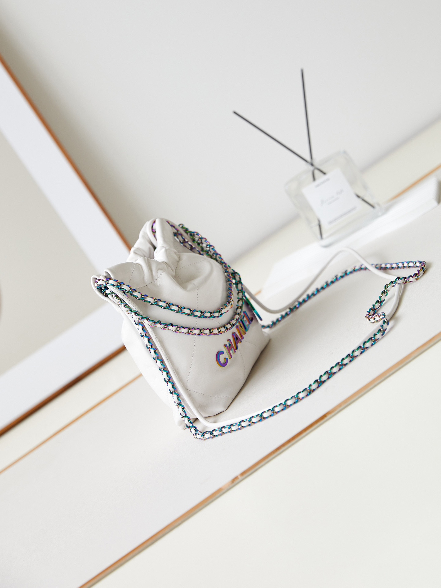 Ch*el 22 mini handbag shiny calfskin & rainbow metal white 7.8 × 7.4 × 2.3 in