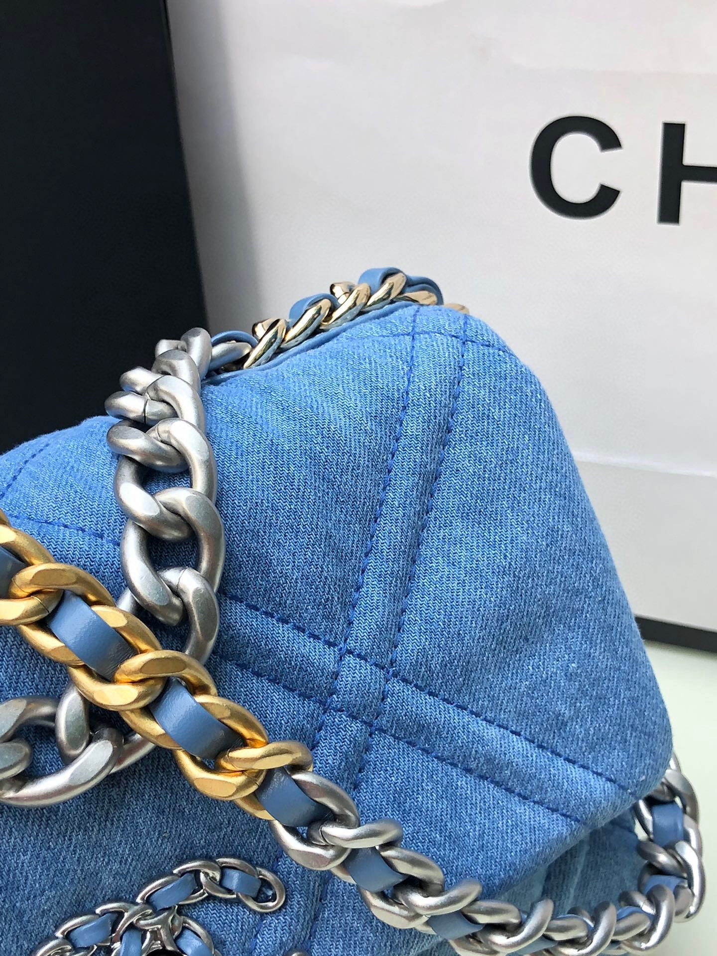 Ch*el 19 handbag, gold-tone, silver-tone & ruthenium-finish metal blue 6.2 × 10.1 × 3.5 in