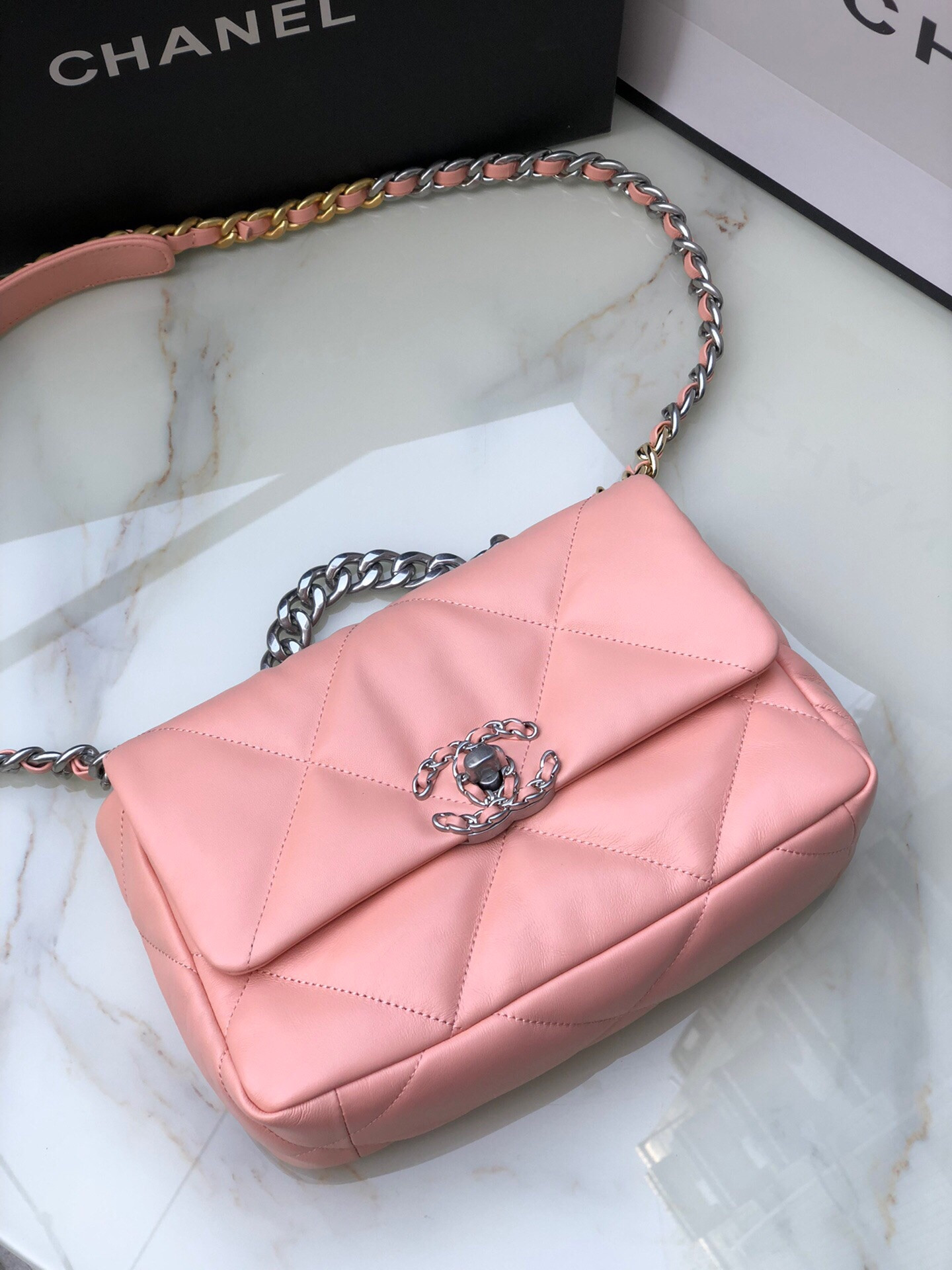Ch*el 19 handbag shiny leather, gold-tone, silver-tone & ruthenium-finish metal light pink 6.2 × 10.1 × 3.5 in