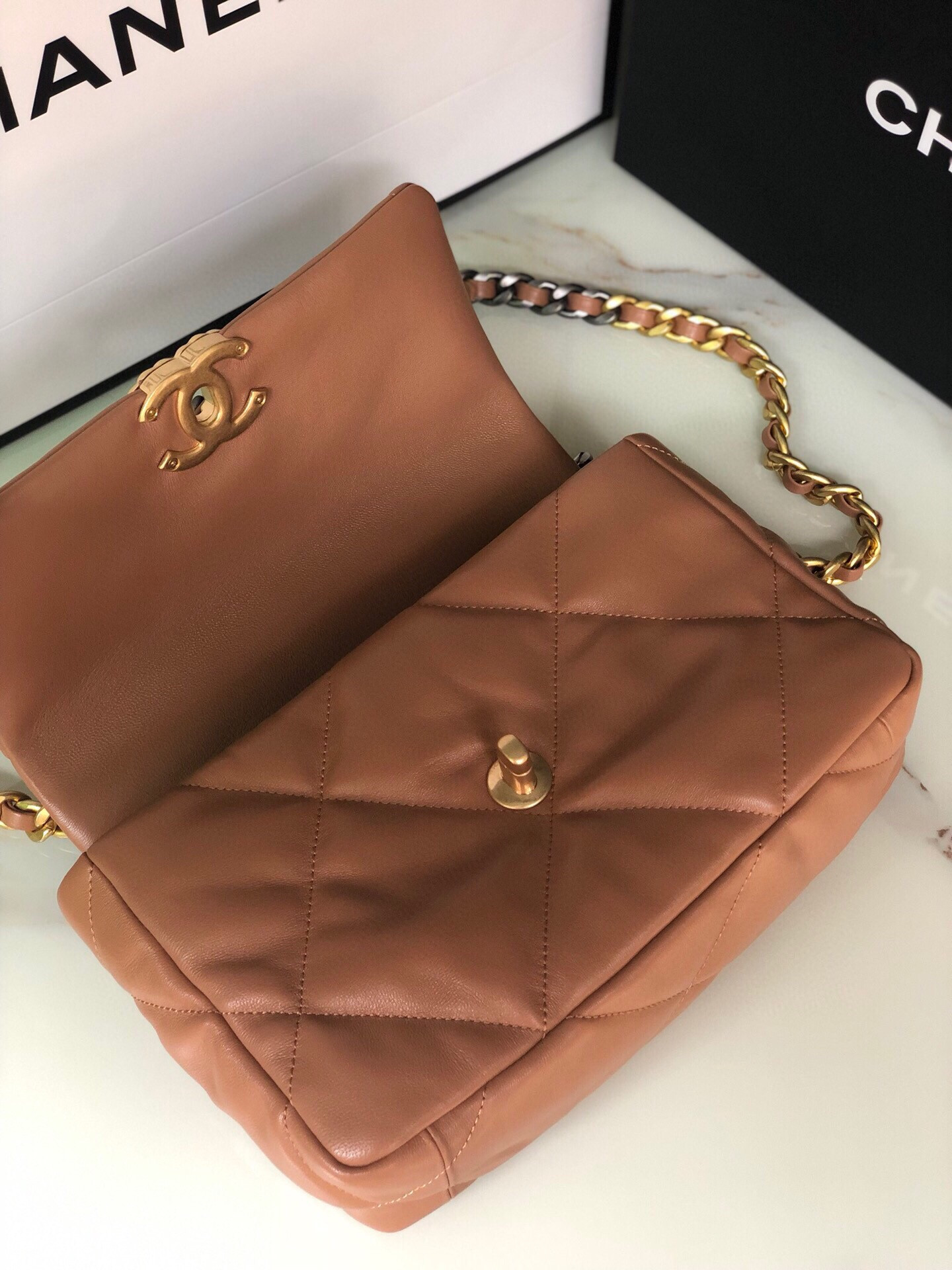 Ch*el 19 handbag shiny leather, gold-tone, silver-tone & ruthenium-finish metal caramel 6.2 × 10.1 × 3.5 in