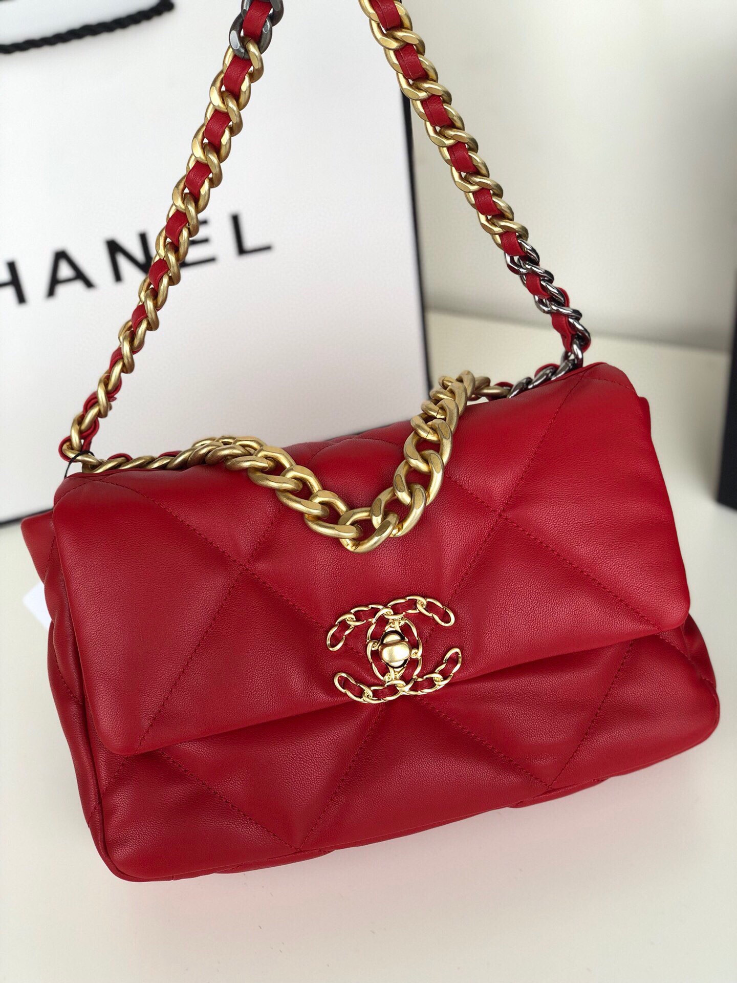 Ch*el 19 handbag shiny leather, gold-tone, silver-tone & ruthenium-finish metal red 6.2 × 10.1 × 3.5 in