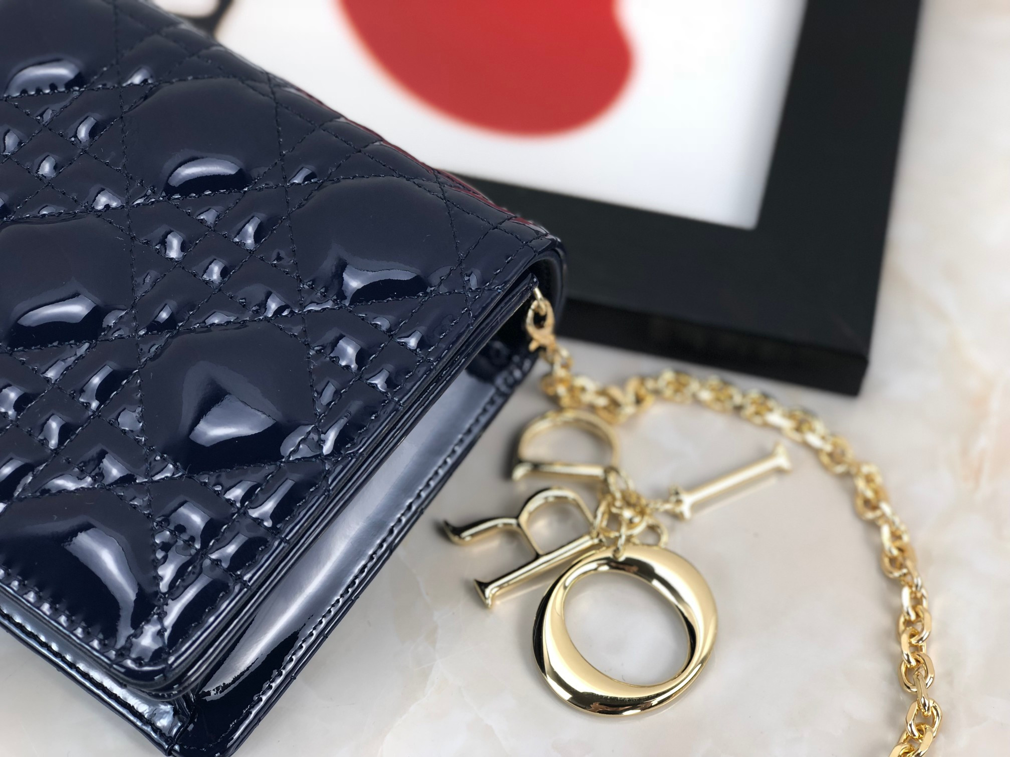 lady D*or pouch  navy patent cannage calfskin 8.5 x 4.5 x 1 inches