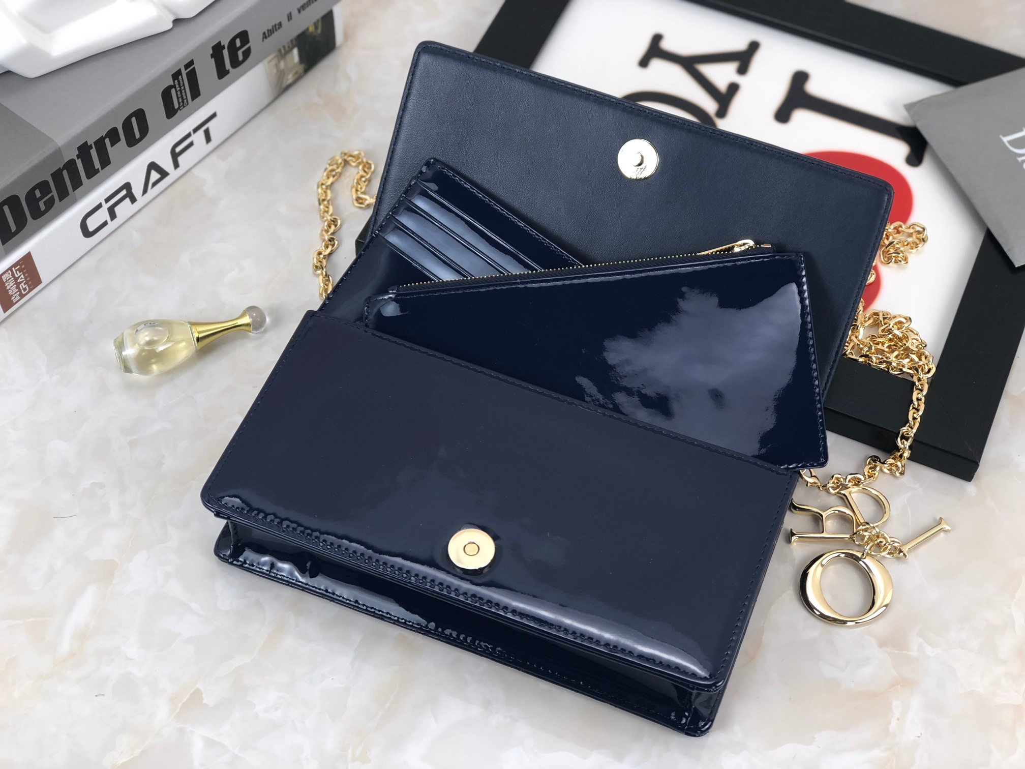 lady D*or pouch  navy patent cannage calfskin 8.5 x 4.5 x 1 inches