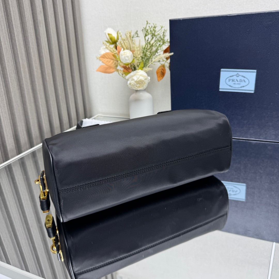 Pra*a re-nylon and leather medium top-handle bag with padlock 12.5x29x10cm