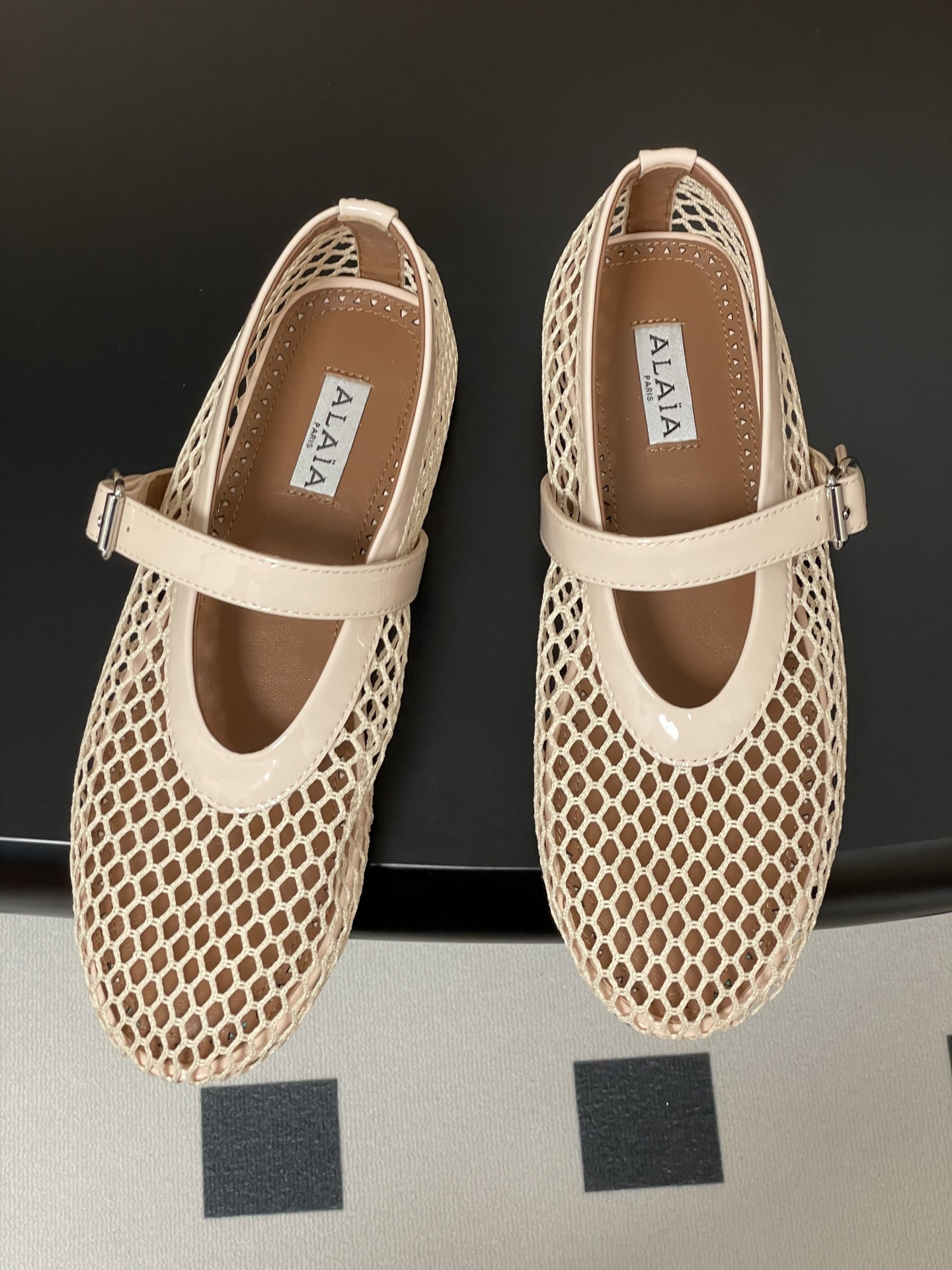 UA ALAÏA BALLET FLATS IN FISHNET